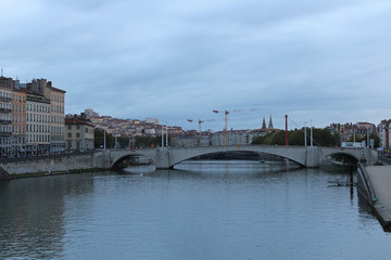 Obraz premium The Pont Bonaparte over the Saone river, the Basilica of Notre-Dame de Fourvièrel, Quai Fulchiron (quay), the Lyon Cathedral and the 5th Library St John Episcopal, France.