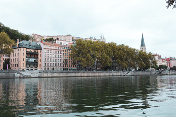 Church of St George with buildings along the Saone River, Quai Fulchiron (quay), in the Old City of Lyon, in the 5th arrondissement (district), Passerelle Saint-Georges bridge, and the Fourviere hill.