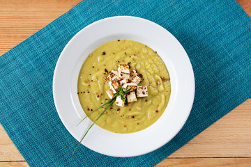 pea broth on a wooden table. Top view