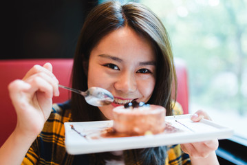 Young Asian woman enjoying delicious food.