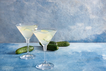 Glasses of tasty cucumber martini on table