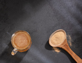 Maca root health drink in a glass with powdered - Lepidium meyenii.