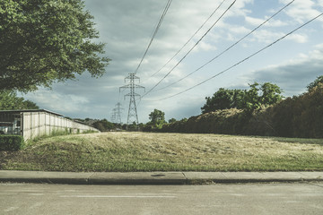 Power line between residential buildings on a spring evening before a thunderstorm.
