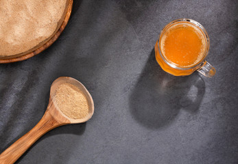 Lepidium meyenii - Maca root health drink in a glass with powdered