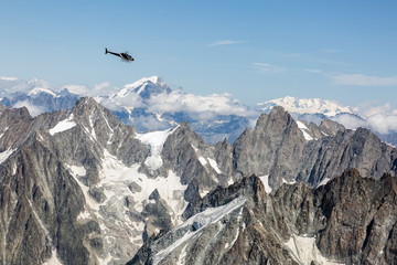 Helicopter over Aiguille du midi in the French Alps, Chamonix-Mont-Blanc, France