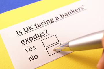 Obraz premium Is UK facing a banker's exodus? Yes or no?