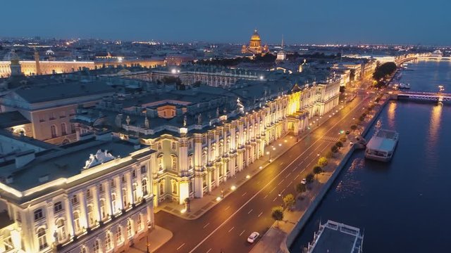 Aerial above St. Petersburg night Winter palace. Downtown historical cityscape. Neva river promenade, old streets, Palace bridge. Saint Isaac's Cathedral, Admiralty. Early morning deserted road nobody