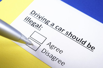 Fototapeta premium Driving a car Should be illegal: Agree or Disagree?