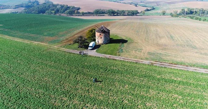 Wide angle dolly in drone shot of green fields and surrounding landscapes in eastern part of czech republic in moravia during the day