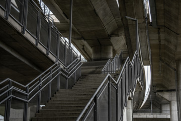 Stairs underneath heavy concrete bridge. Ada bridge Belgrade