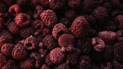 raspberries on a black background