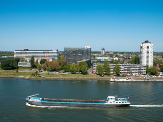 Obraz premium Rotterdam, Netherlands - May 07, 2020: view on the cargo port buildings infrastructure from cruise ship