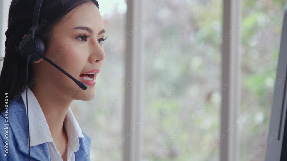 Aufkleber customer support agent or call center with headset works on desktop computer while supporting the cu