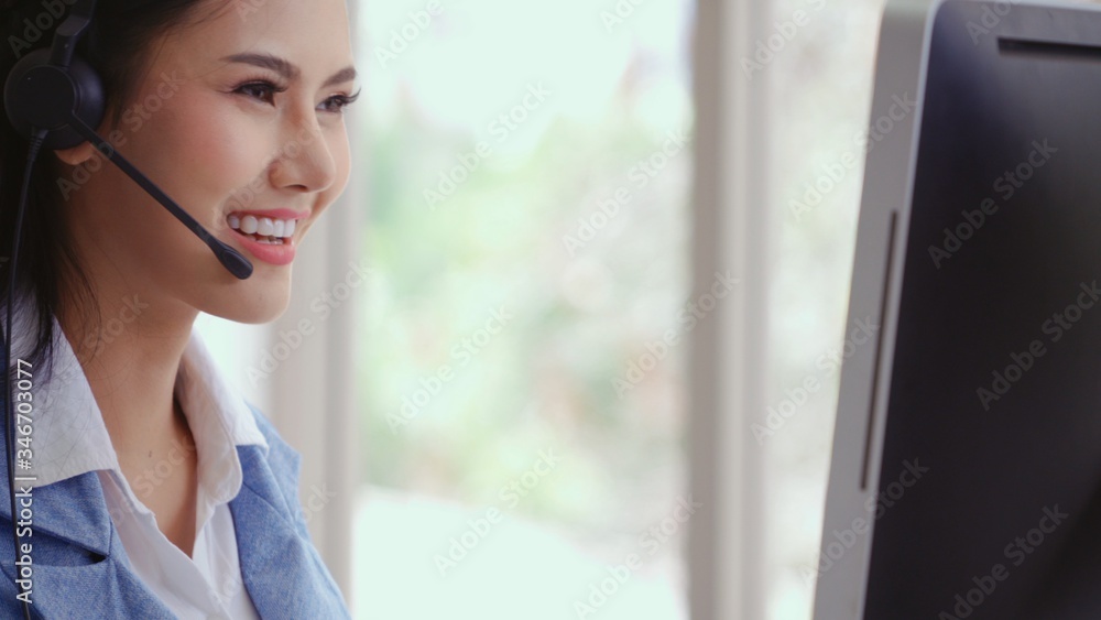 Aufkleber customer support agent or call center with headset works on desktop computer while supporting the cu