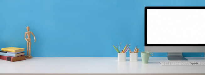 Close up view of creative workspace with blank screen computer, supplies and copy space © bongkarn
