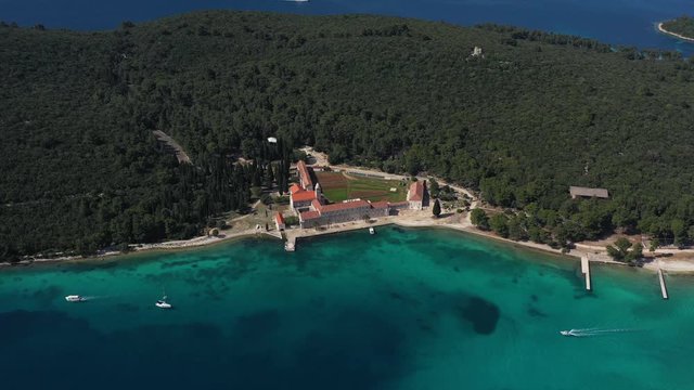 Beautiful Franciscan Monastery Badija on Island of Badija, southern Croatia, surrounded with turquoise Sea - Aerial Panoramic View