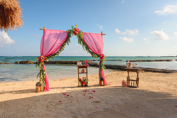 Wedding arch on the beach and a tropical beach.