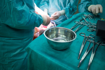 some sterile surgical instruments are on a table during an operation