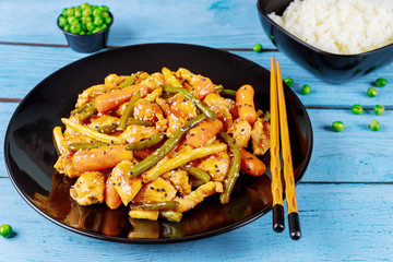 Fried chicken teriyaki with sweet and sour sauce. Chinese cuisine.