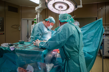 a surgical team performs a surgical abdominal operation