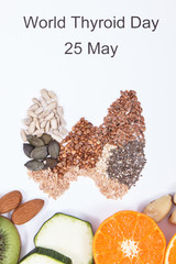 Inscription World Thyroid Day 25 May and thyroid shape made of natural ingredients. Best food for healthy thyroid. White background