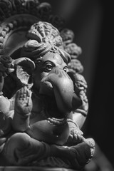 Fototapeta na wymiar The Ganesha statue in black & white. Ganesha (also known as Ganesa or Ganapati) is one of the most important gods in Hindu mythology and he is also worshipped in Jainism and Buddhism.