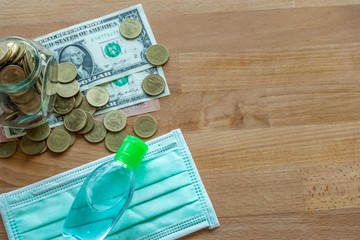 Money face mask and hand sanitizer.