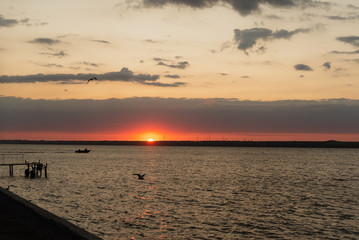 Sunrise at sea a beautiful dawn gives peace and silence for a normal life and exercise in the early morning.