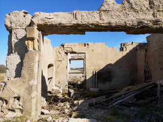 Old derelict soviet farm ruins in spring