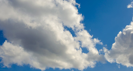 White clouds in a blue sky.