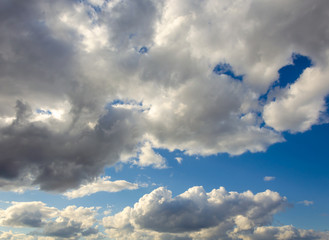 Rain clouds in the blue sky.