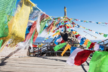 Prayer flags and stupa at the peak of Shika Snow Mountain or Blue Moon Valley, landmark and popular...