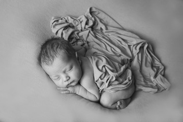 the concept of healthy lifestyle, IVF - a newborn baby sleeps under a blanket. Copy space