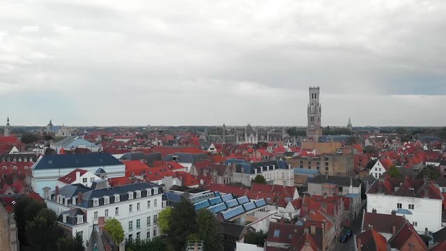 Traditional red roofs of the scenic city of Bruges in Belgium, aerial HD