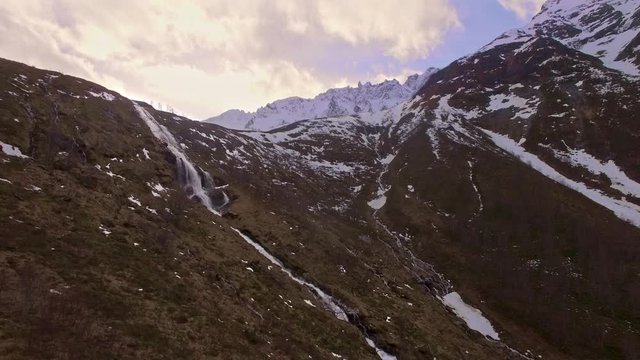 Drone footage from the Norwegian village &Oslash;rsta, with the river Skaarelva in Skaar. A popular trip from the fjord hjorundfjord. One of Sunnmores most beautiful places, called sunnmorealpane.