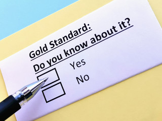 One person is answering quetion about gold standard.