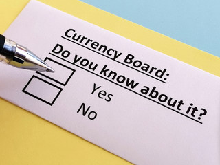 One person is answering quetion about currency board.