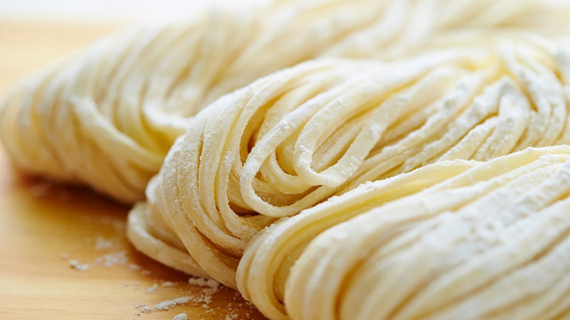 Udon noodle on wooden board 