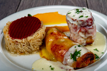 lunch with meat roll with vegetables and sauces and beets