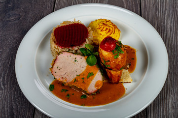 in the plate we find the meat flavor of potatoes and vegetables with cabbage and sauces