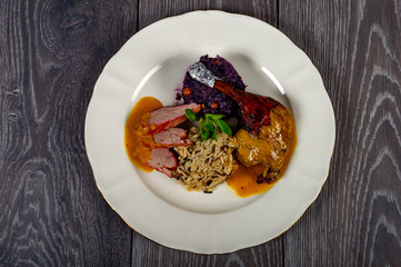 in the plate we find the meat flavor of potatoes and vegetables with cabbage and sauces