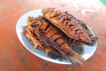 Ikan bakar are various kinds of popular Maritime Southeast Asian dishes, prepared with charcoal-grilled fish or other forms of seafood, notable in Indonesian and Malaysian cuisines.