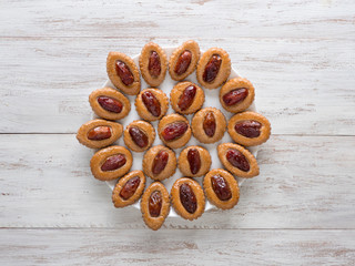 Ramadan food background. Eid Dates sweets on a white wood background
