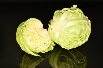 Fototapeta premium Green cabbage, macro, on a black background