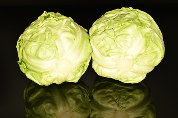 Fototapeta premium Green cabbage, macro, on a black background