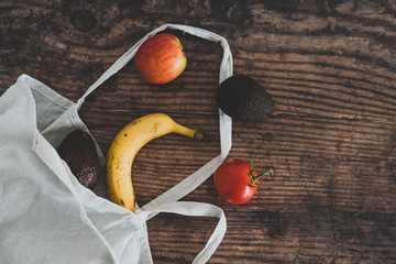 plant-based food, market bag with fruit and veggies popping out of it