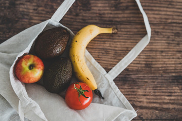 plant-based food, market bag with fruit and veggies popping out of it