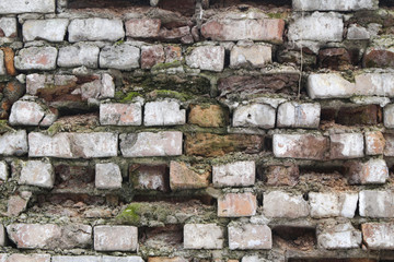 Old brickwork with fallen bricks.