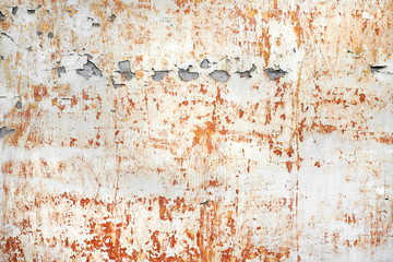 shabby red stucco with cracks and flakes of paint