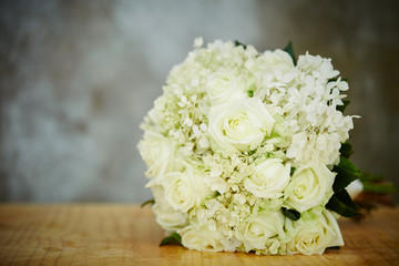 Flower bouquet on wooden table 